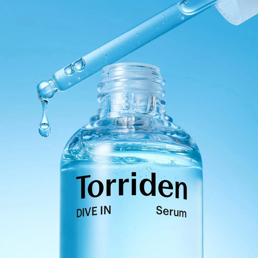 Torriden serum bottle with dropper on a blue background