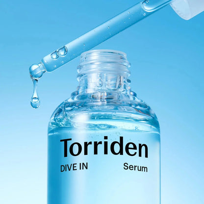Torriden serum bottle with dropper on a blue background
